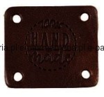 etykieta skórzana "hand made" 05 ciemny brąz 32x38mm 
